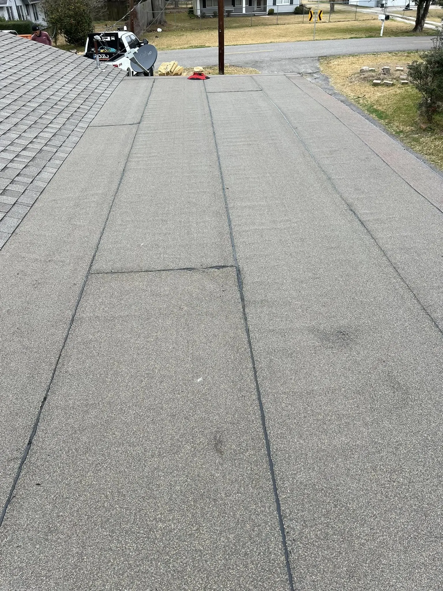 Flat residential roof system in Groves TX with membrane surface